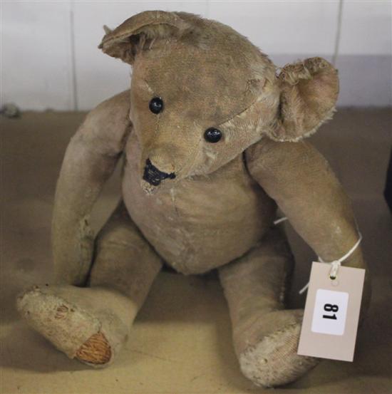 Early 20C teddy bear, probably Steiff, very worn, with boot button eyes, elongated muzzle & limbs, 40cm approx